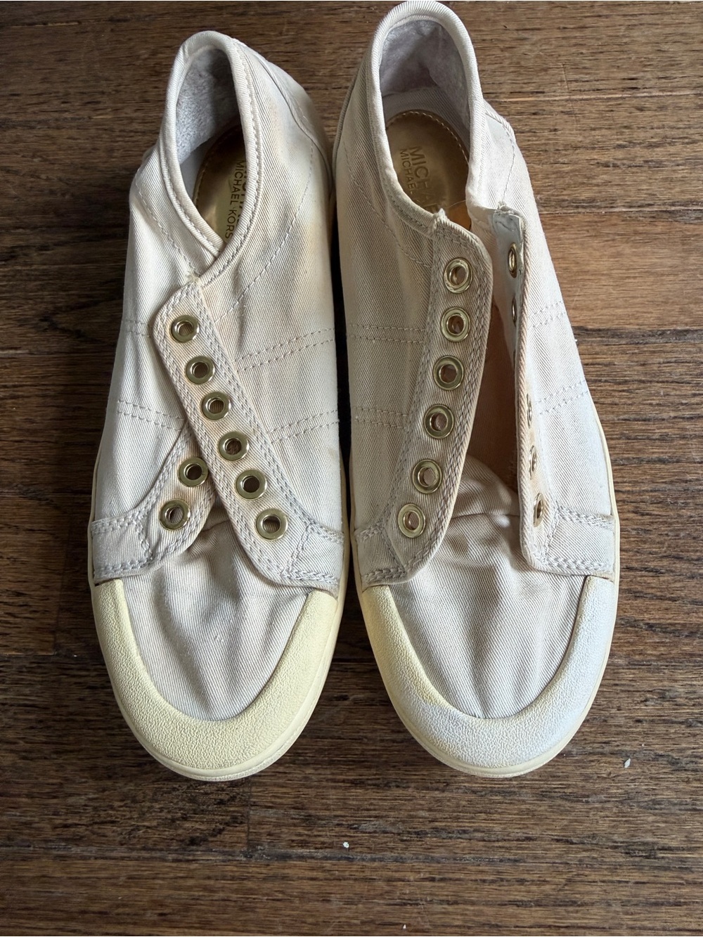 Michael Kors Beige/Cream Canvas Slip-On Sneakers with Gold Eyelets